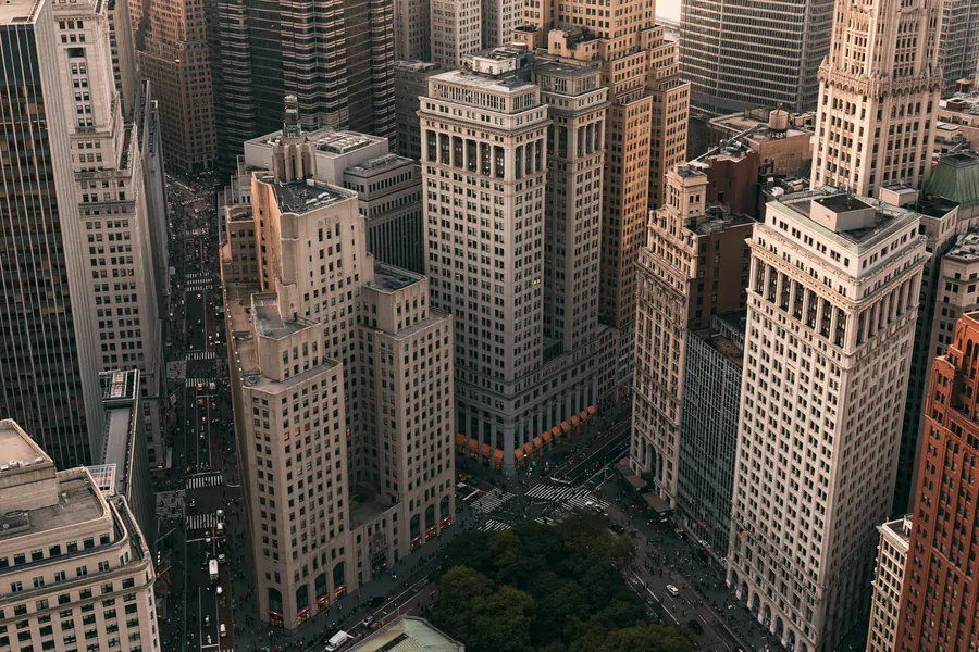 Aerial view of downtown office towers and busy streets in a financial district